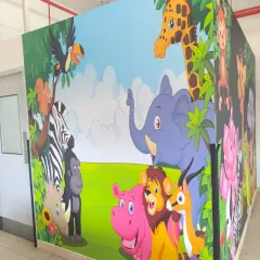 Another angle of the large jungle animal mural, showing how it wraps around a corner to create an immersive scene.