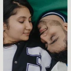 An intimate overhead shot of the couple resting on the basketball court. This quiet moment amidst a playful theme shows a different, more tender side of their connection.