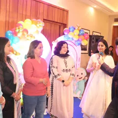 Engaging with the ladies at a Cocomelon-themed first birthday party. I make sure the parents and adult guests have just as much fun as the children.