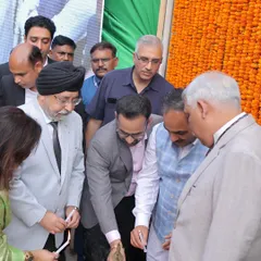 Participating in the traditional lamp lighting ceremony to inaugurate the Independence Day celebrations, a symbol of dispelling darkness with light.