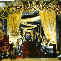 For a dramatic and glamorous Sangeet, we designed this stunning masquerade-themed entrance. The combination of black and gold draping, pampas grass arrangements, and intricate mask motifs creates a sense of mystery and excitement, welcoming guests to a night of high energy celebration.
