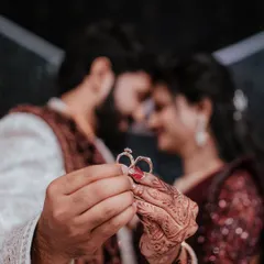 A creative shot focusing on the ultimate symbols of commitment. We love finding unique ways to photograph engagement rings, turning a small detail into a powerful statement about your love story.