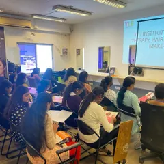 Students engaged in a theory class at our institute. A strong theoretical foundation is key to understanding the 'why' behind the techniques we teach.