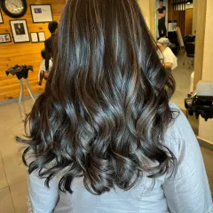 This is a classic brown balayage with soft, blended highlights. The result is super glossy and healthy-looking hair with just the right amount of dimension.
