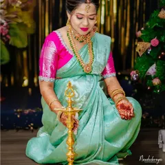 The lighting of the lamp is a sacred moment in many traditional ceremonies. We captured this mother-to-be during her baby shower, her grace and devotion shining in a beautiful solo portrait that honors the ritual.