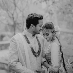 A tender black and white portrait from a wedding in Udaipur. The groom's gentle gaze and the bride's serene expression tell a story of comfort and deep affection.