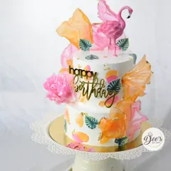 This angle shows the beautiful color combination and the dynamic arrangement of the wafer paper sails on the tropical cake.
