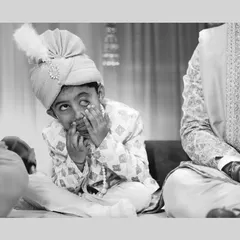 A young guest making funny faces during the ceremony. Capturing the antics of children adds a layer of charm and humor to your wedding album.