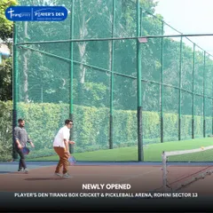 Players engaged in a pickleball rally during the inauguration of our Rohini arena. The surrounding greenery provides a pleasant and refreshing atmosphere for a game.
