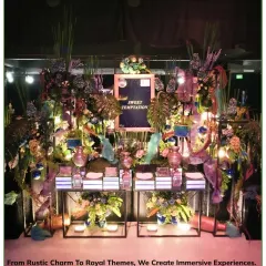 A 'Sweet Temptation' dessert station designed with a mystical forest theme, using deep colors, exotic florals, and whimsical elements to create an immersive experience.