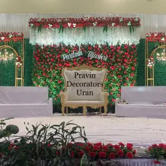 A classic combination of red and green for a timeless wedding stage. We created a full floral wall with red roses as the centerpiece, framed by green foliage panels and elegant gold-trimmed arches for a luxurious feel.