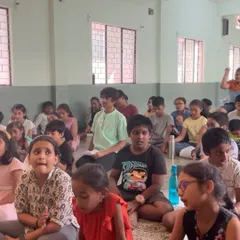 The children are fully engaged during a group singing activity. My classes focus on listening and participation, creating a collective learning experience.
