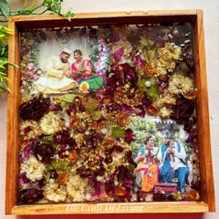 This is one of my favorite creations. A beautiful wedding varmala, with its rich colors and textures, preserved forever in a solid teak wood frame. I included two of the couple's favorite photos to complete their story.