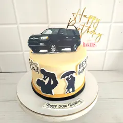 This cake was for Vikram's 50th birthday, a tribute to his love for road trips and cars. I used edible silhouettes to depict his roles as a husband and father, making it a deeply personal, no-fondant fresh fruit cake.