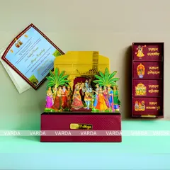 Celebrate your union with this magnificent Shiv Parvati wedding invitation box. The design features a colorful 3D pop-up of the divine couple and their wedding procession, along with separate small boxes for prasad or gifts.