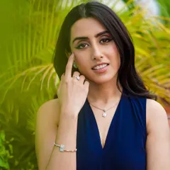 A full view of the jewelry set from the House of Diamondtine campaign. The outdoor setting provides a fresh, natural context that makes the fine jewelry feel accessible and wearable for everyday luxury.