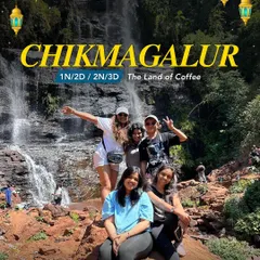 A group of women sits happily by a waterfall in Chikmagalur, the Land of Coffee. My trips are about finding these beautiful spots to relax and have fun.
