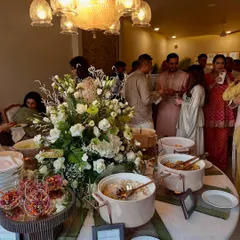 A view of our buffet setup, with guests happily serving themselves. Our team ensures the spread is always fresh, full, and beautifully presented.