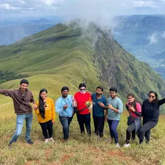 A happy group photo from the top of Nethravathi peak. The clear skies on this day gave us an incredible panoramic view of the surrounding Western Ghats.