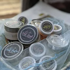 A collection of my skincare products, including Foot Soak, Foot Balm, Lip Scrubs, and Lip Balms. Each one is labeled and ready to be part of your self-care routine.