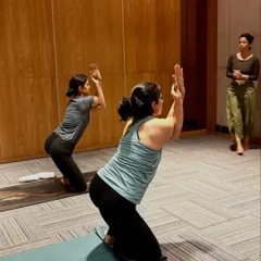 Observing students as they hold Garudasana (Eagle Pose) arms. This allows me to see where they need support and offer verbal cues to refine their posture.