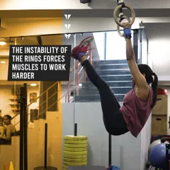 The instability of gymnastic rings forces your muscles to work harder, engaging stabilizers you never knew you had. Here, an athlete demonstrates a toes-to-ring, building immense core control.