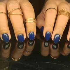 A deep and sophisticated royal blue manicure, offering a bold yet elegant look.