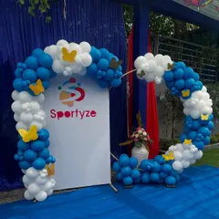 Your brand is the star of the show. We seamlessly integrate your company's identity into the decor, as seen in this custom balloon arch featuring the Sportyze logo and brand colors, creating a perfect photo opportunity for a product launch or family day.