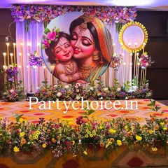 The stage setup for a naming ceremony before the cradle is placed. The design features a beautiful floral stage border, elegant candle-like lighting, and a central illustrated backdrop.