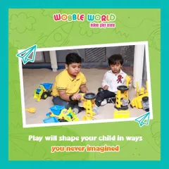 Two boys working together in the sand pit with construction toys. This area encourages imaginative play and social interaction.