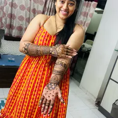 A happy bride showing off her full bridal mehendi. Seeing my clients this happy with the final result is the best part of my job.