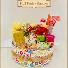 A cheerful and floral-themed round hamper for Holi. This box is filled with colorful items and treats, making it a delightful gift for friends and family.