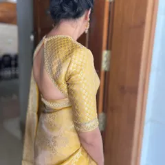 The back view of my yellow brocade blouse, showing the keyhole cut-out design. I love creating blouses that are as beautiful from the back as they are from the front.