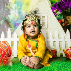 A classic Janmashtami theme shoot with a baby boy dressed as Lord Krishna. I provide the complete costume, including the crown and flute, for this special festive photoshoot.