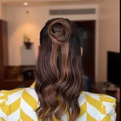 Another look at the beautiful top knot, showcasing the texture and highlights in her hair.