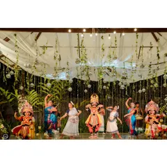 The stage is set for a night of performances. I used a ceiling treatment of white drapes, green creepers, and suspended disco balls to create a dynamic and festive backdrop for the dancers.