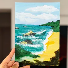 A beautiful beach scene painted with acrylics. We guide you on how to paint the waves, sand, and sky to create a peaceful coastal landscape.