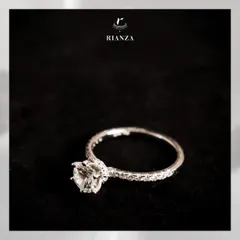 This solitaire ring features a hidden halo, a popular and trending style that adds extra sparkle from every angle. It's a classy design perfect for daily wear.