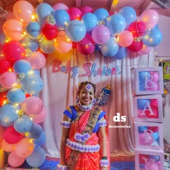 Capturing the joy of a traditional Dohale Jevan or baby shower. I blend cultural elements with modern decor, like this beautiful balloon arch with integrated fairy lights, creating the perfect backdrop for the happy mom-to-be.