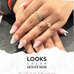 A perfect example of bridal nail artistry. These elegant almond-shaped extensions are finished with a classic French manicure base and accented with delicate 3D crystal embellishments for that extra sparkle on the big day.