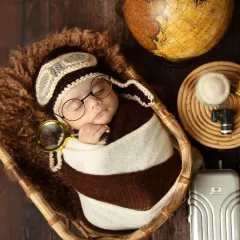 Ready for their first big adventure! This creative traveler-themed shoot is so much fun to put together, with props like a tiny globe, suitcase, and an aviator cap to tell a unique story for your little explorer.