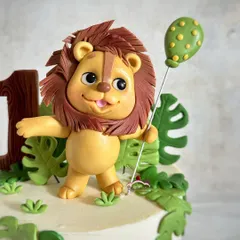 I had a hard time parting with this cute, handcrafted lion topper, complete with his own party balloon.