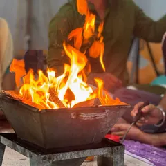 A close-up of the sacred fire (Hawan Kund), symbolizing the purification of mind, body, and environment.