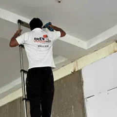 My technician is shown here carefully mounting a dome camera. We use professional tools and techniques to ensure every camera is securely fitted and positioned for the best possible viewing angle.