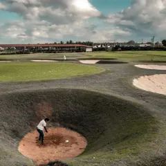 Our practice facility includes uniquely challenging features like this deep pot bunker. We provide golfers with the opportunity to master difficult shots they will encounter on championship courses.