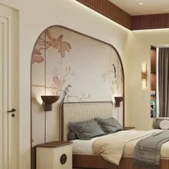 A custom-framed chinoiserie wallpaper with delicate birds and branches acts as a beautiful, art-like headboard, adding a touch of classic elegance.
