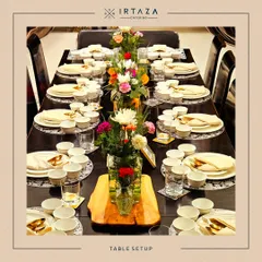 An example of a formal sit-down table arrangement. Each place is meticulously set to create a sophisticated and welcoming dining experience for every guest.
