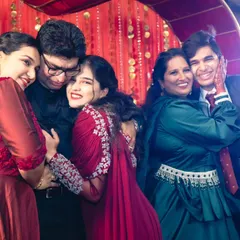 The result of a successful family performance is pure joy. These photos capture the happy, candid moments of a family celebrating together on stage after their dance.
