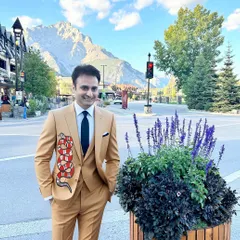 Here is a client wearing his custom-painted suit jacket. The Gucci-inspired snake design wraps around the side, adding a bold and fashionable element to the tailored suit.