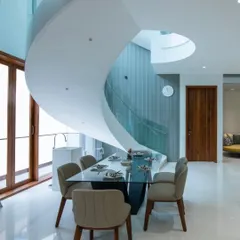 The key lies in viewing the space. This stunning spiral staircase appears to be molded from a single piece, creating a sense of wholeness and drawing the eye upward.